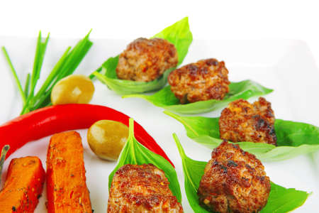 small french beef cutlets on basil with potatoesの写真素材