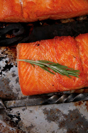 delicious portion of raw fresh salmon fillet with aromatic herbs and spices on vintage tray over wooden table - healthy food, diet cooking conceptの写真素材