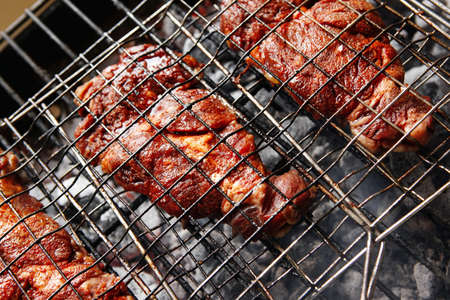 grilled roast meats beef lamb fillet ribs on bbq grid over charcoal