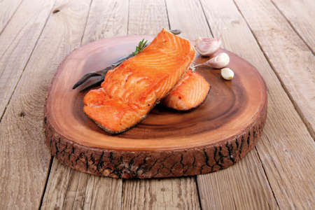 breakfast delicious portion of fresh roast salmon fillet with dry spices garlic and rosemary on...