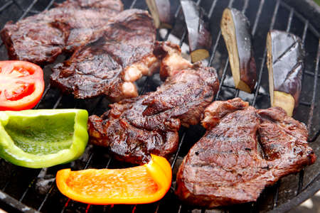 ready grilled fillet mignon served with garnish of eggplants on barbecue bbq grillの写真素材