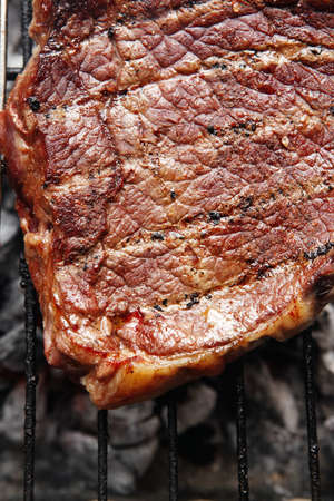 grilled roast meats beef lamb fillet ribs on bbq grid over charcoal