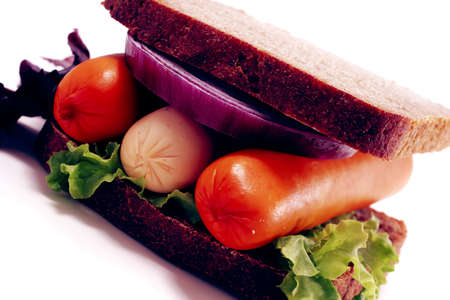 fresh beef meat sausage sandwich with green salad and tomatoes isolated on white backgroundの写真素材
