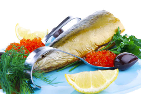 diet food - red caviar and smoked mackerel fish with lemon and dill on blue plate isolated over white backgroundの写真素材