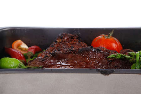 fresh glazed baked big beef meat rib chunk under sweet sauce with tomatoes hot chili pepper pink...