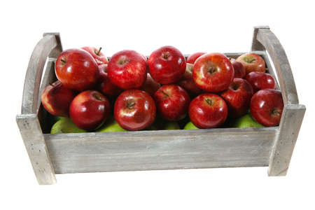 fresh red apples in vintage grey box ready to sell isolated on white backgroundの写真素材