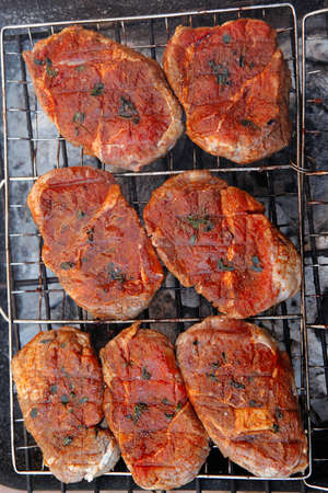 fresh beef meat fillet steak on barbecue grill grid cooked over burned charcoal readyの写真素材