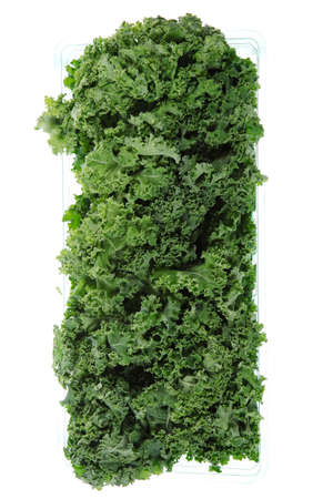 fresh raw green kale packed in plastic box ready to sell isolated over white backgroundの写真素材