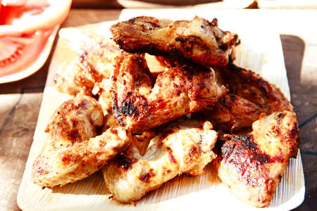 fresh roast chicken wings over bbq gridの写真素材