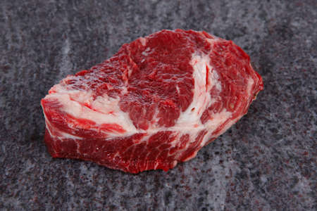 fresh raw beef meat ribeye steak on marble plateの写真素材