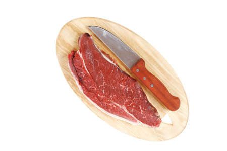 raw meat beefsteak fillet with knife on wood isolated over white backgroundの写真素材