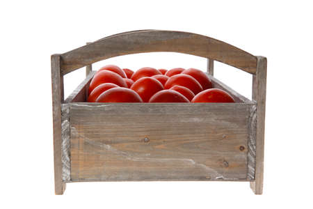 fresh red raw tomatoes in antique grey retro design box isolated over white backgroundの写真素材