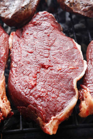 grilled roast meats beef lamb fillet ribs on bbq grid over charcoalの写真素材