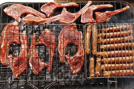 grilled roast meat lamb ribs on barbecue grid over charcoal