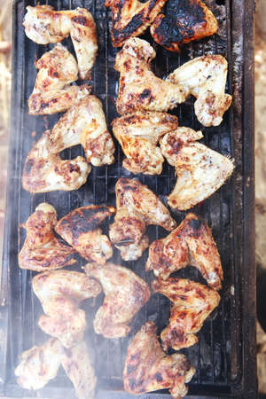 fresh roast chicken wings over bbq gridの写真素材