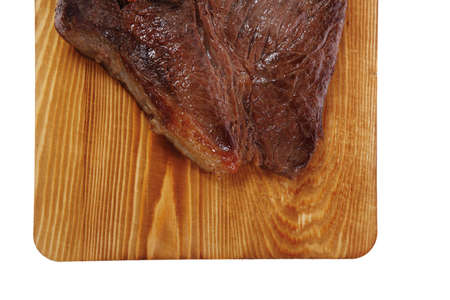 roast beefsteak fillet on wood isolated over white backgroundの写真素材