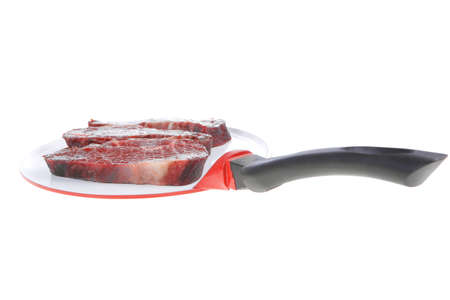 three fresh raw marble beef meat sirloin porterhouse steak on big ceramic cooking pan isolated on white backgroundの写真素材