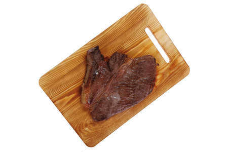roast beefsteak fillet on wood isolated over white backgroundの写真素材