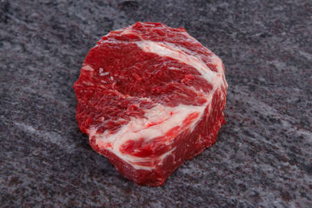 fresh raw beef meat ribeye steak on marble plateの写真素材