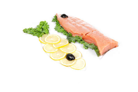 healthy food - fresh raw red fish with kale lemon and black olives on plate isolated on white background space for textの写真素材