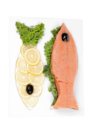 healthy food - fresh raw red fish with kale lemon and black olives on plate isolated on white background space for textの写真素材