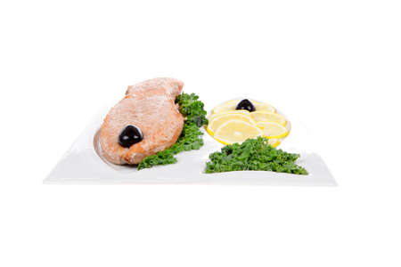 healthy food - fresh roast red fish salmon with kale lemon and black olives on plate isolated on white background space for textの写真素材