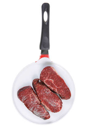 three fresh raw marble beef meat sirloin porterhouse steak on big ceramic cooking pan isolated on white backgroundの写真素材