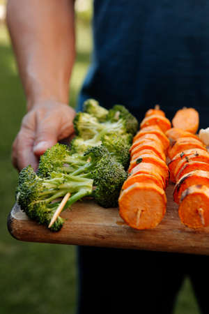 fresh raw vegetable kebab on bbq grid cooked over hot burned charcoalの写真素材