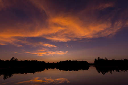 Post sunset glow on Spider Lake in Northern Wisconsinの写真素材