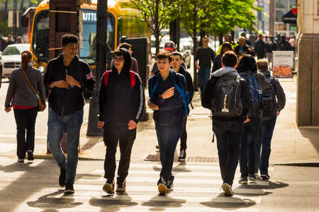 CHICAGO - May 29, 2019: A group of young men cross South Wabash Street in Chicago.のeditorial素材