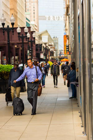 CHICAGO - May 29, 2019: Businessman walking on South Wabash Street in the Chicago Loop.のeditorial素材