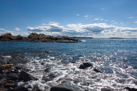 High tide fills a rocky tidal poolの写真素材