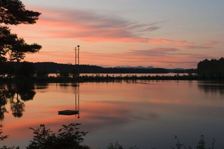 Sunset over a New England lake in summerの写真素材