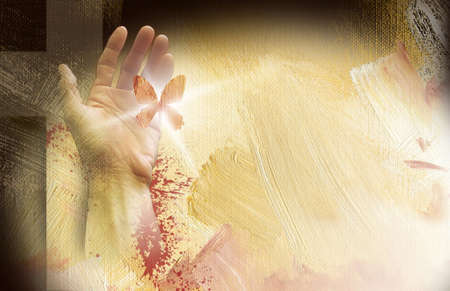 photo composition of Cross of Jesus and hand with freed butterfly on painted oil backgroundの写真素材