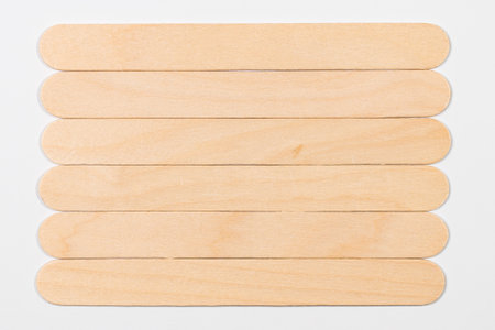 Wooden board isolated on white background. Top view. Flat lay.の写真素材