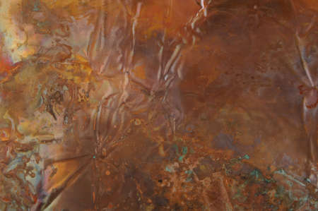 An abstract image of rainbow hued copperの写真素材