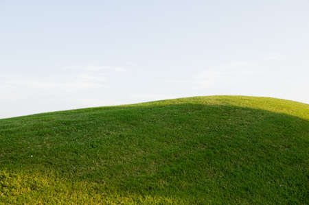An image of grassy hill on a golf courseの写真素材