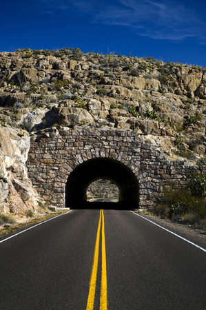 Image of a highway heading into a tunnelの写真素材