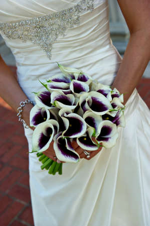 Image closeup of a beautiful bouquet being held by a bride's handsの写真素材