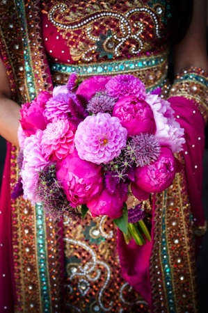 Image of an Indian brides hands holding bouquetの写真素材