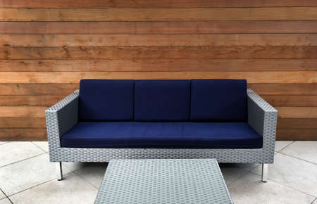 Image on a patio of a contemporary blue and silver outdoor couchの写真素材