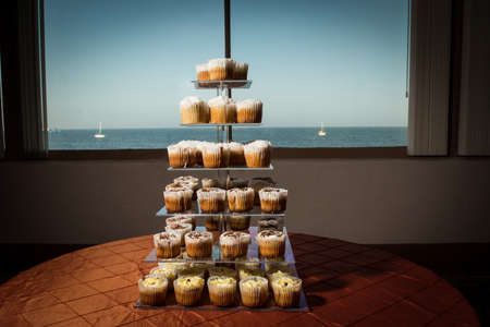 cupcakes on a tiered stand at a weddingの写真素材