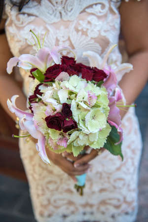 Closeup Image of a bride holding a bouquetの写真素材