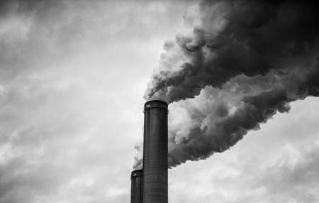 closer up view of smoking smokestacks in Black and Whiteの写真素材
