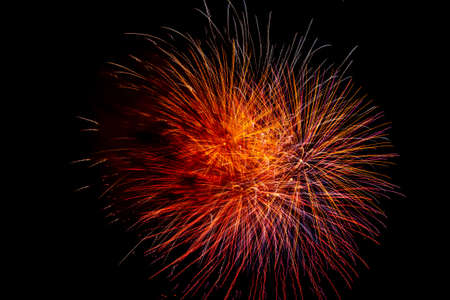 Image of a colorful fireworks display on dark sky background.の写真素材