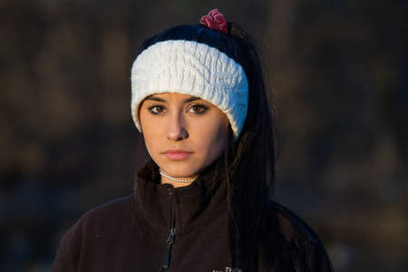Image of a brunette girl looking into the cameraの写真素材