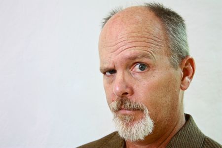 Man with slight smirk on his faceの写真素材