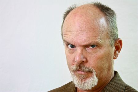 Man with slight smirk on his faceの写真素材