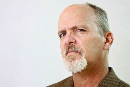 Man with slight smirk on his faceの写真素材