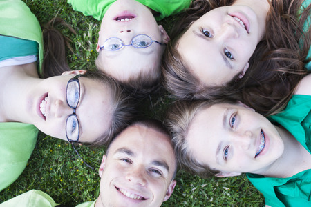 Brothers and Sisters on the Grassの写真素材